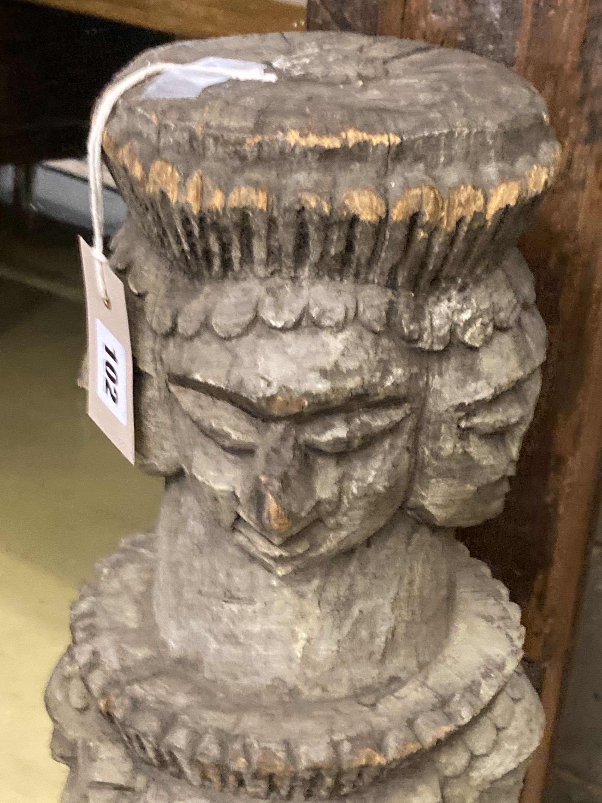 A South East Asian carved column, 90cm high